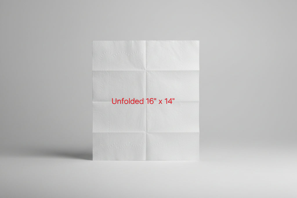 Unfolded white paper towel sheet on a brown surface with text indicating size.