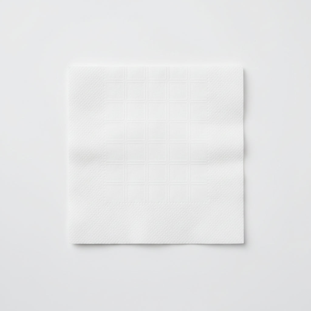 White foam core board with a ruler indicating unfolded size 9" x 9" on a brown background